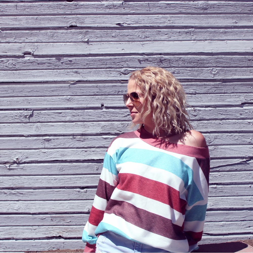 New from our boutique off the shoulder striped long sleeve sweater!